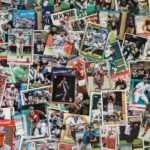 A variety of sports trading cards displayed in a cluttered arrangement.