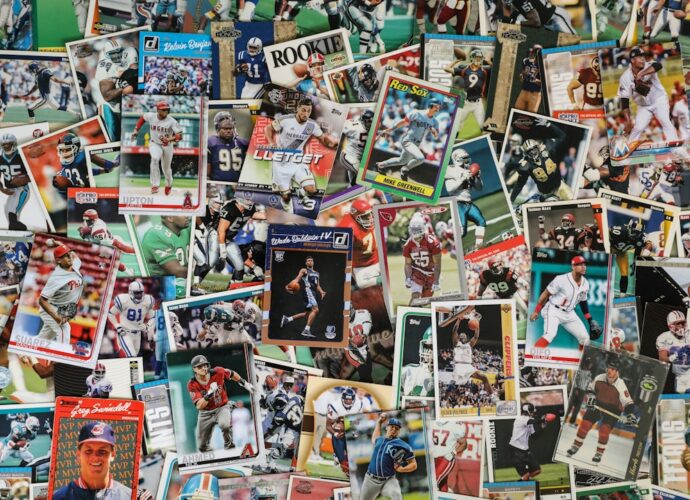 A variety of sports trading cards displayed in a cluttered arrangement.