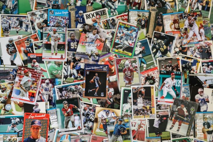 A variety of sports trading cards displayed in a cluttered arrangement.