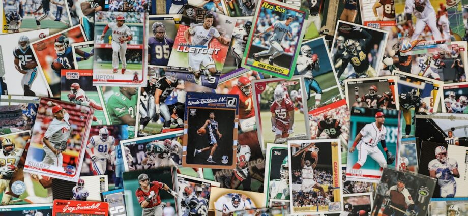A variety of sports trading cards displayed in a cluttered arrangement.
